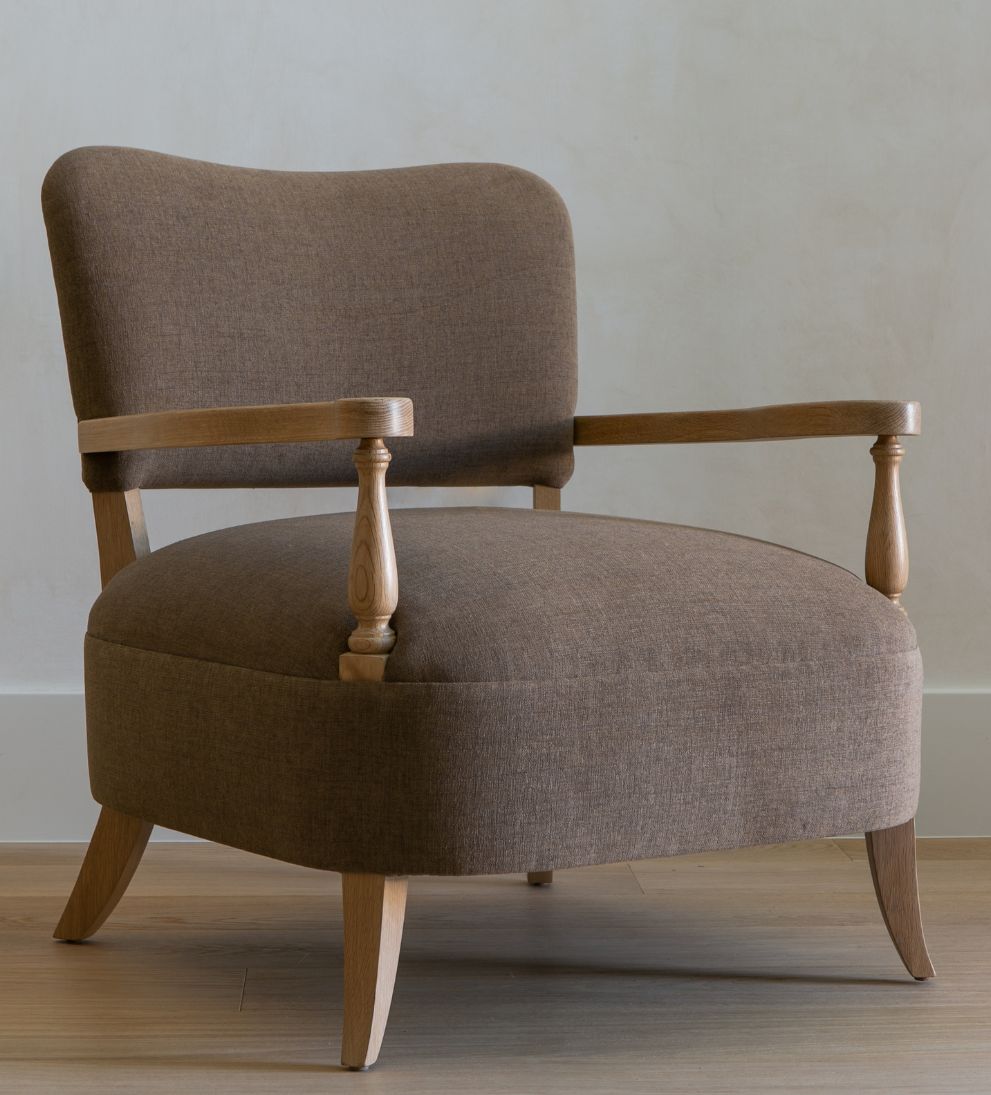Betty Lounge Chair - Traditional meets contemporary in the Betty Lounge Chair. - I love the curved arms and turned wood spindles of this chair.