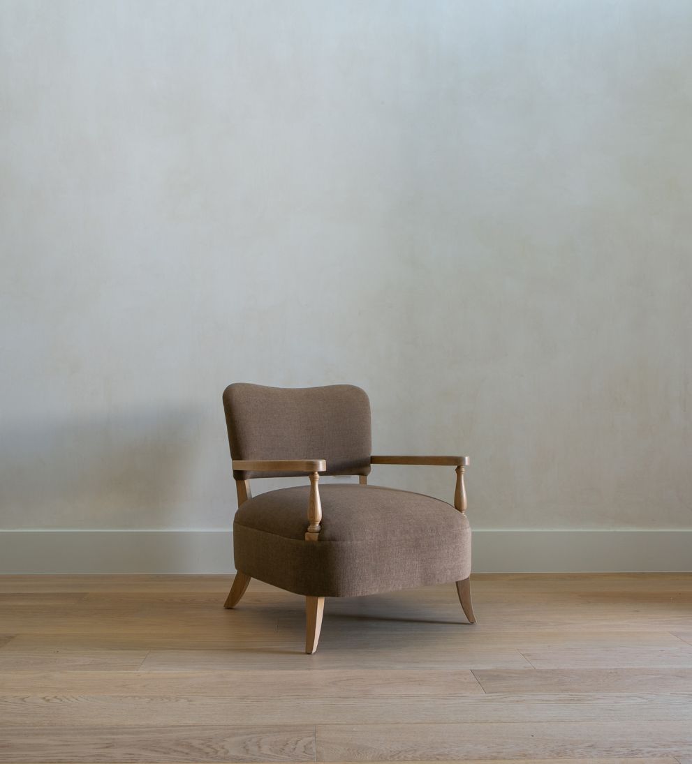 Betty Lounge Chair - Traditional meets contemporary in the Betty Lounge Chair. - I love the curved arms and turned wood spindles of this chair.