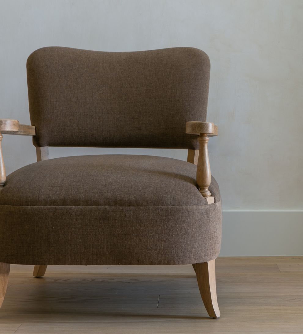 Betty Lounge Chair - Traditional meets contemporary in the Betty Lounge Chair. - I love the curved arms and turned wood spindles of this chair.