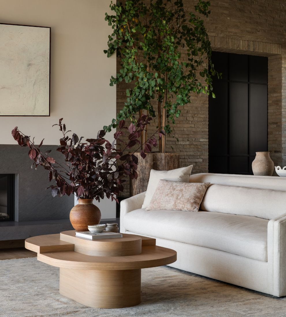 Emma White Oak Tiered Coffee Table - This asymmetrical top coffee table will bring a creative touch to any area - talk about a conversation starter!