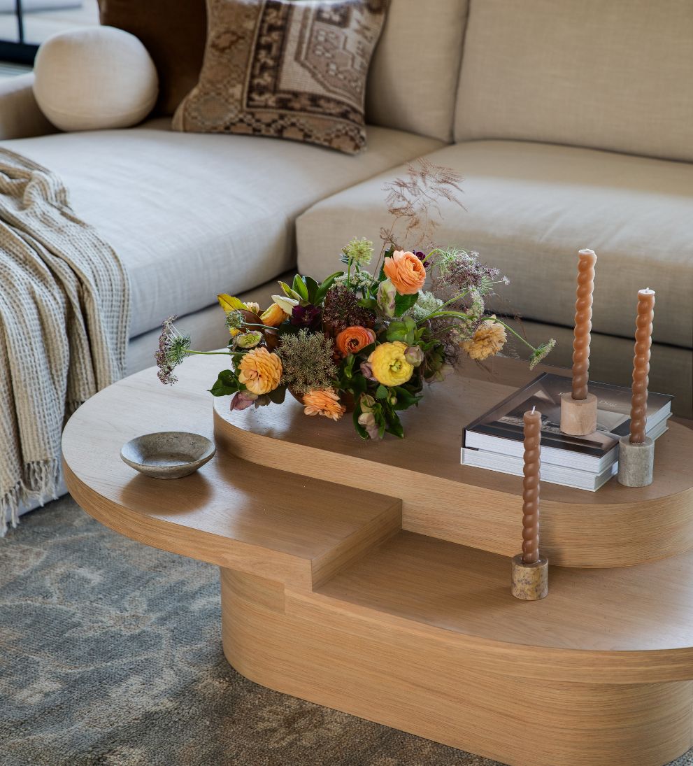 Emma White Oak Tiered Coffee Table - This asymmetrical top coffee table will bring a creative touch to any area - talk about a conversation starter!