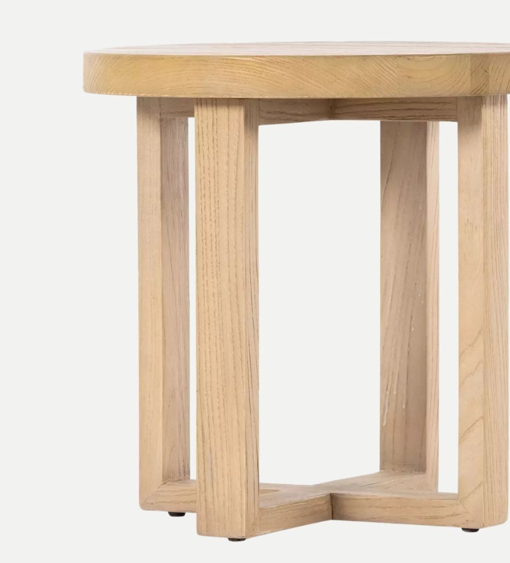 Liv End Table - Introducing the Liv End Table! - Crafted from natural nettlewood, its sturdy, cross-style base supports a rounded tabletop with a soft