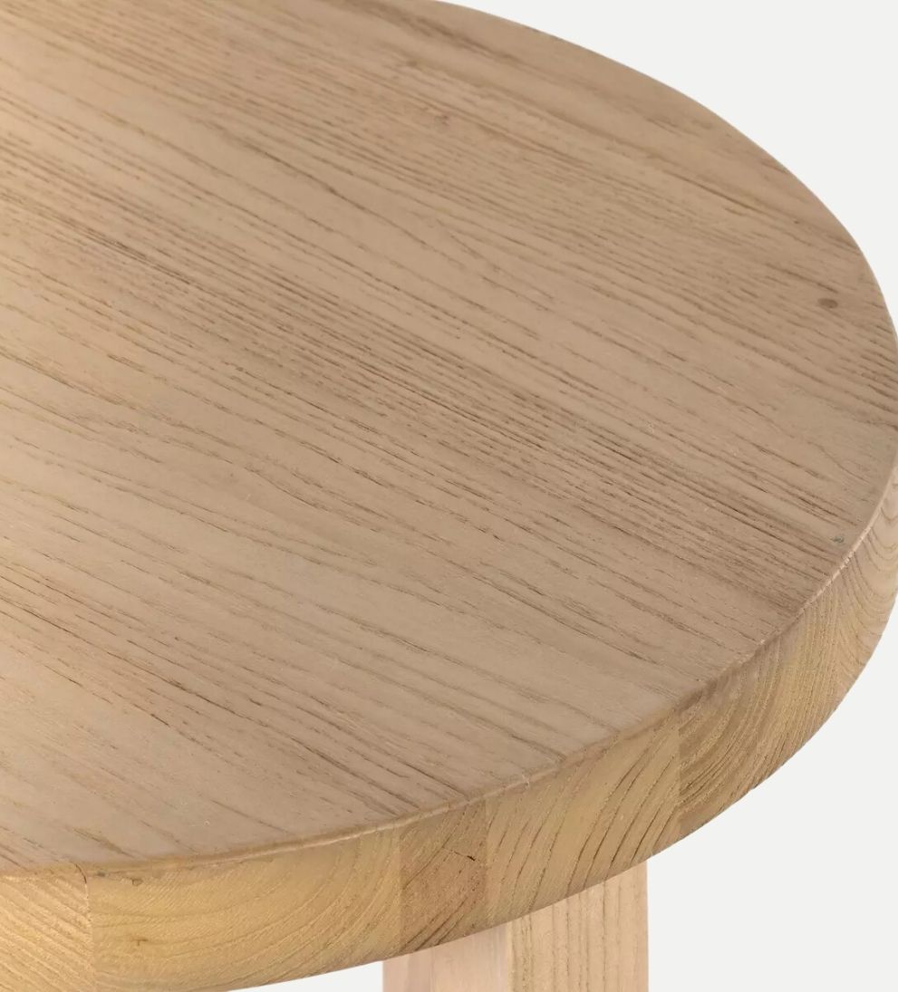 Liv End Table - Introducing the Liv End Table! - Crafted from natural nettlewood, its sturdy, cross-style base supports a rounded tabletop with a soft
